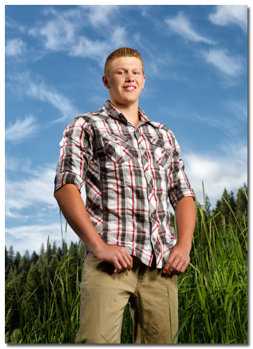 senior photos with blue sky and clouds