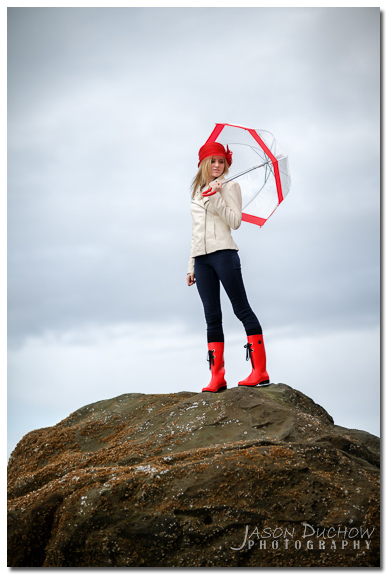 rainy day portrait with a red umbrella and rain boots